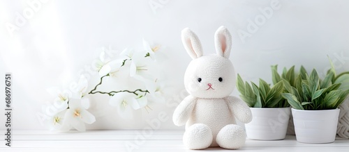 Handmade white Easter bunny textile toy, DIY soft toy for decoration.