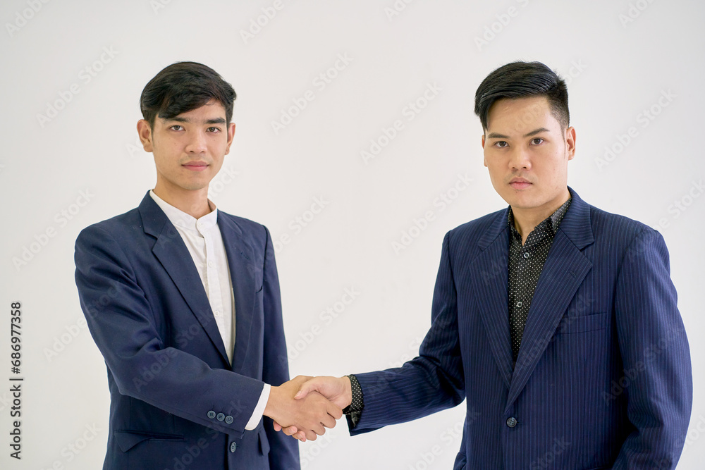 Two businessman shake hand together on isolate background for commitment or agree. Two businessman shake hand together on isolate background for commitment or agree.