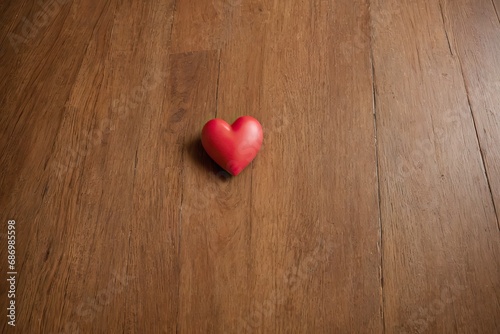 Solitary Red Heart on a Wooden Background