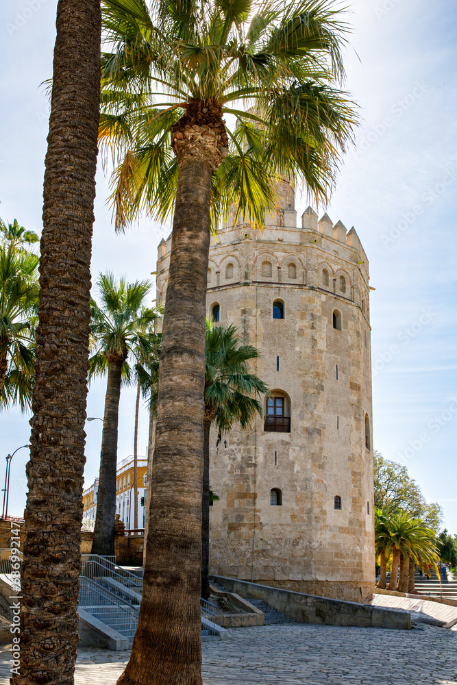 View of the Torre del Oro in Seville, Andalusia, Spain over the Guadalquivir river on sunny day