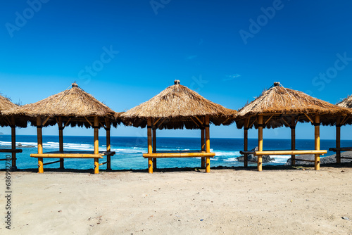 beach hut looking over the ocean on sandy beach in Indonesia. beach view in Lombok  Indonesia