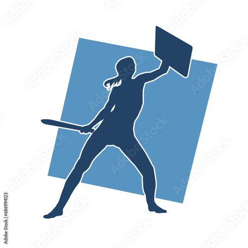 Silhouette of an ancient woman warrior in fighting pose with sword weapon and iron shield.