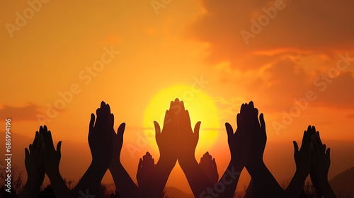 Free concept: Raised hands catching sun on sunset sky. Generative Ai © hassanmim2021