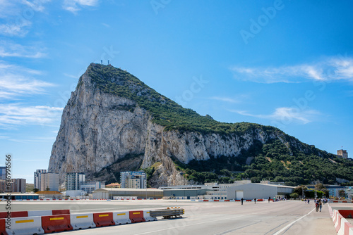 Road to the Rock of Gibraltar with marina on the left and town behind, view from La Linea, Spain