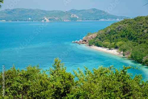 Viewpoint over Ko Kham Island Sattahip Chonburi Samaesan Thailand a tropical island with turqouse colored ocen, you can reach the viewpoint after a short hike in the jungle © Chirapriya