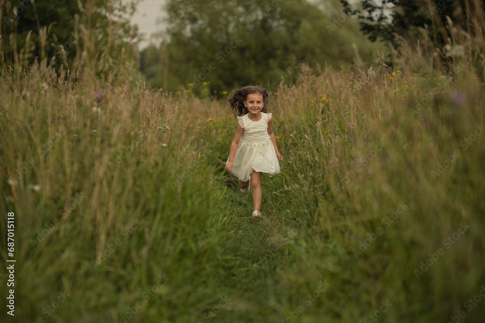 In mid-stride, the girl exudes excitement, against the backdrop of nature s embrace. The scene captures the essence of current trends towards experiential learning and play. In mid-stride, the girl exudes excitement, against the backdrop of nature s embrace. The scene captures the essence of current trends towards experiential learning and play.