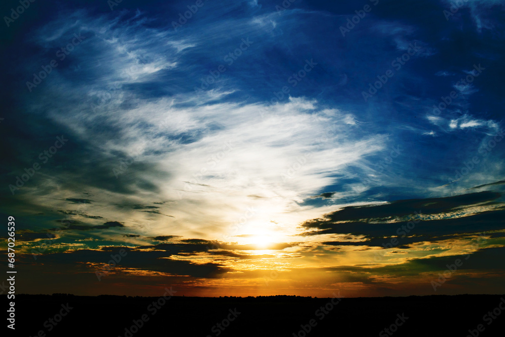Sunset background. High contrast sunset. Simple skyscape evening. Cloudy dawn sky. Late dusk horizon.