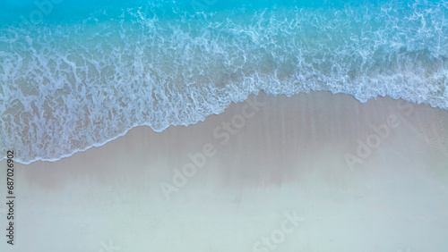 Beach Wave water in the Tropical summer beach with sandy beach background