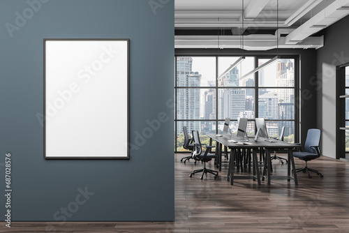 Gray and blue open space office with poster