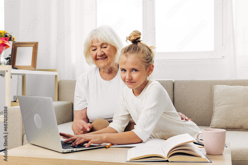 Hugging child laptop family grandmother