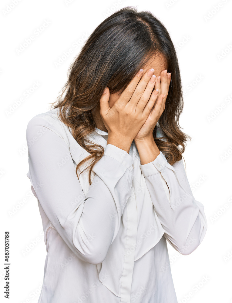 Young brunette woman wearing casual clothes with sad expression covering face with hands while crying. depression concept. Young brunette woman wearing casual clothes with sad expression covering face with hands while crying. depression concept.