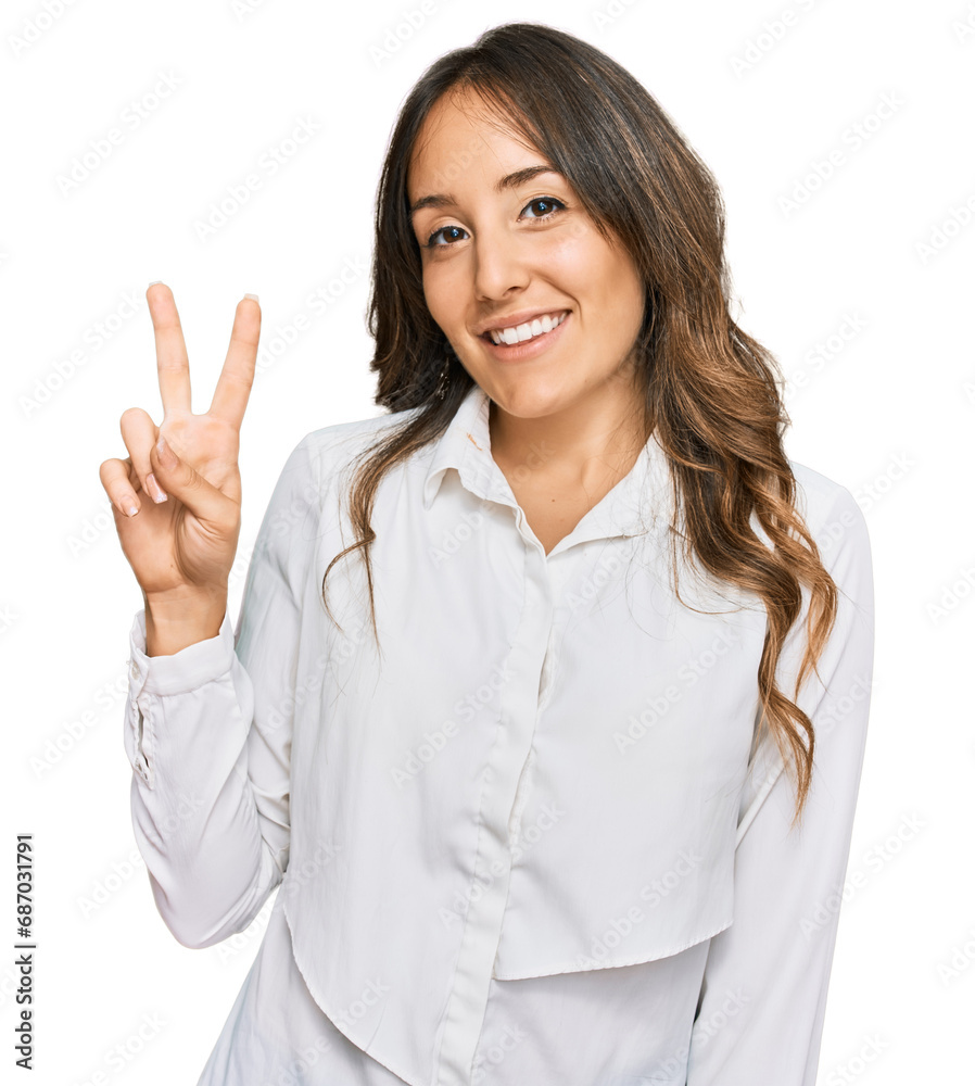 Young brunette woman wearing casual clothes showing and pointing up with fingers number two while smiling confident and happy. Young brunette woman wearing casual clothes showing and pointing up with fingers number two while smiling confident and happy.