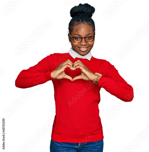 Young african american woman wearing casual clothes and glasses smiling in love showing heart symbol and shape with hands. romantic concept.