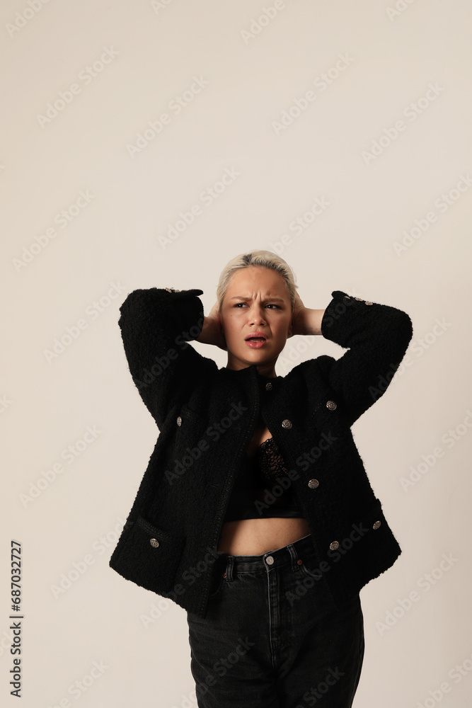 Studio portrait of emotional woman doing face grimace posing on white background