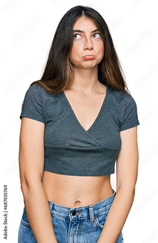 Young beautiful teen girl wearing casual crop top t shirt depressed and worry for distress, crying angry and afraid. sad expression. Young beautiful teen girl wearing casual crop top t shirt depressed and worry for distress, crying angry and afraid. sad expression.