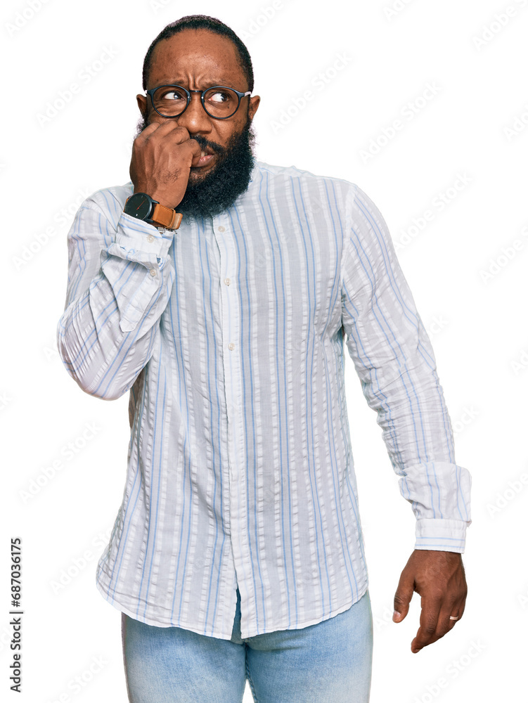 Young african american man wearing business shirt and glasses looking stressed and nervous with hands on mouth biting nails. anxiety problem. Young african american man wearing business shirt and glasses looking stressed and nervous with hands on mouth biting nails. anxiety problem.