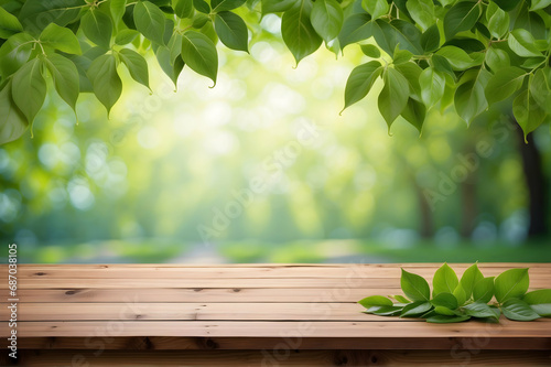 Empty wooden table with green leaf background, green leaves on wooden background 