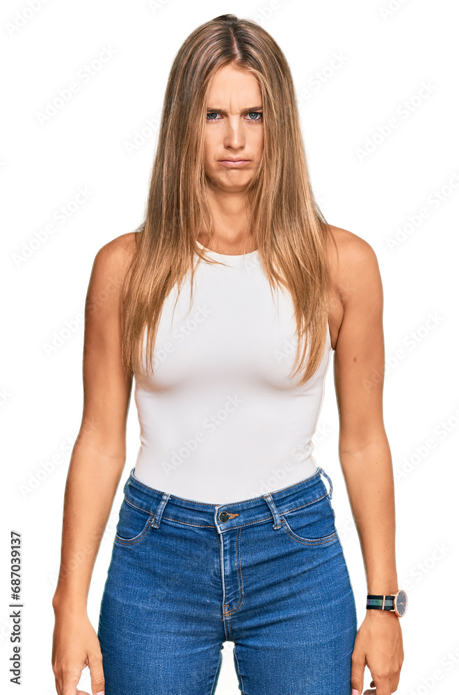 Fototapeta premium Young blonde woman wearing casual style with sleeveless shirt skeptic and nervous, frowning upset because of problem. negative person.