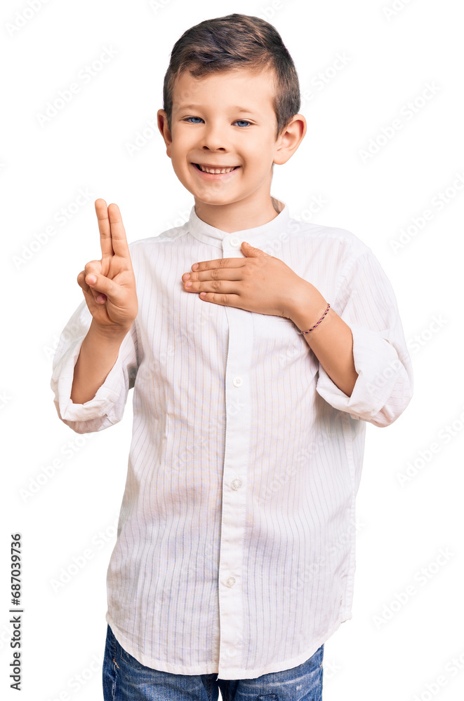 Cute blond kid wearing elegant shirt smiling swearing with hand on chest and fingers up, making a loyalty promise oath Cute blond kid wearing elegant shirt smiling swearing with hand on chest and fingers up, making a loyalty promise oath