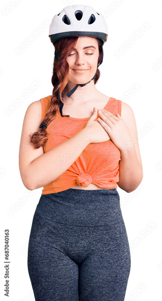 Young beautiful woman wearing bike helmet smiling with hands on chest with closed eyes and grateful gesture on face. health concept.