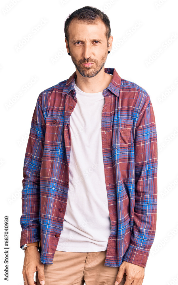 Young handsome man wearing casual clothes depressed and worry for distress, crying angry and afraid. sad expression.