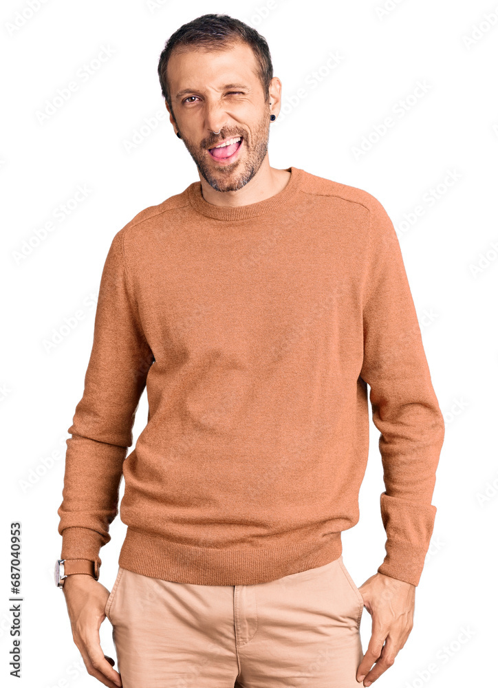 Young handsome man wearing casual clothes winking looking at the camera with sexy expression, cheerful and happy face. Young handsome man wearing casual clothes winking looking at the camera with sexy expression, cheerful and happy face.