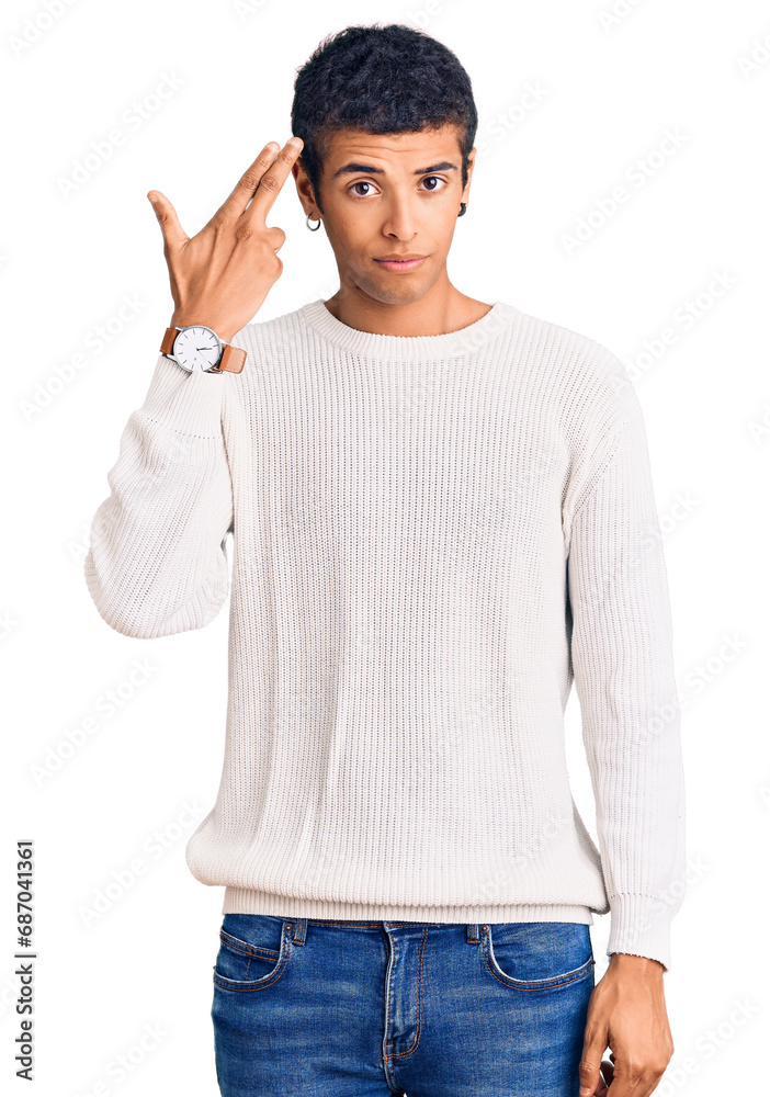 Young african amercian man wearing casual clothes shooting and killing oneself pointing hand and fingers to head like gun, suicide gesture. Young african amercian man wearing casual clothes shooting and killing oneself pointing hand and fingers to head like gun, suicide gesture.