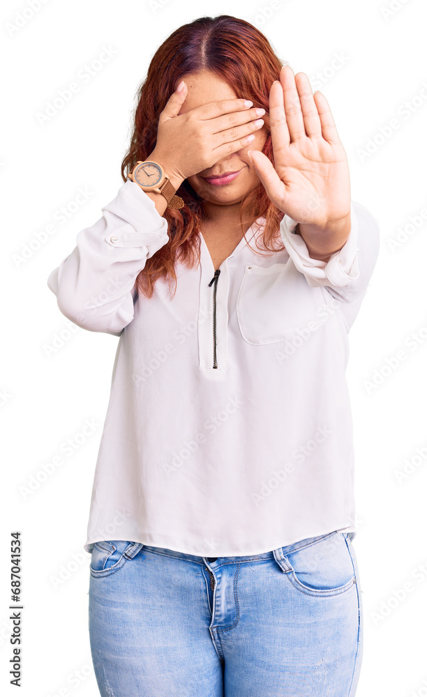 Young latin woman wearing casual clothes covering eyes with hands and doing stop gesture with sad and fear expression. embarrassed and negative concept.