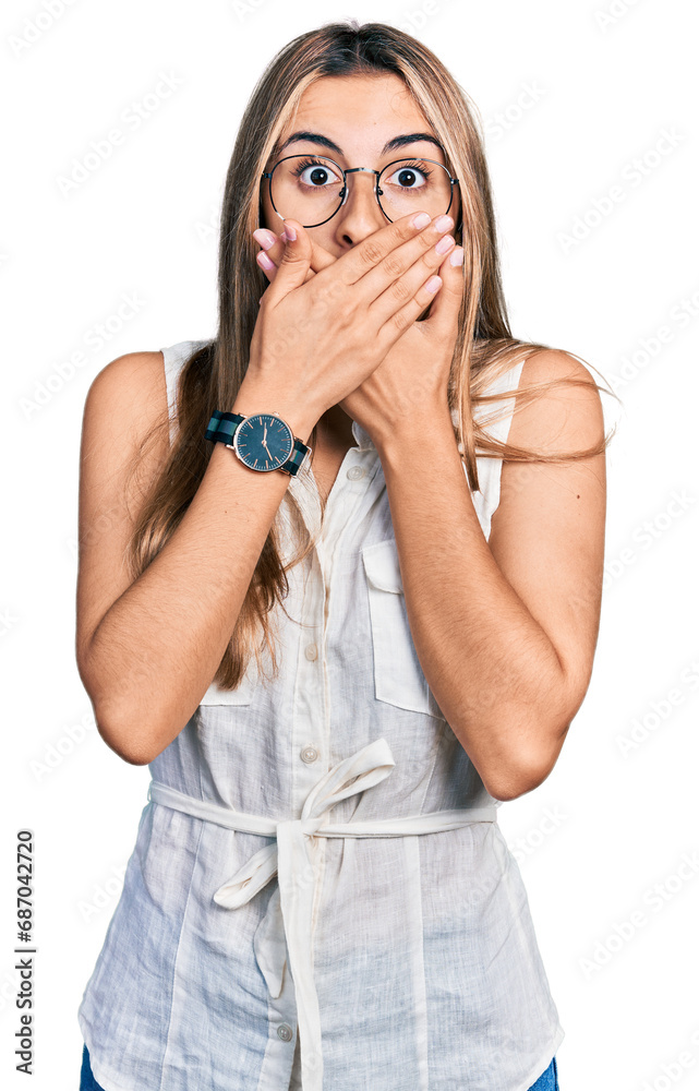 Hispanic young woman wearing casual white shirt shocked covering mouth with hands for mistake. secret concept. Hispanic young woman wearing casual white shirt shocked covering mouth with hands for mistake. secret concept.