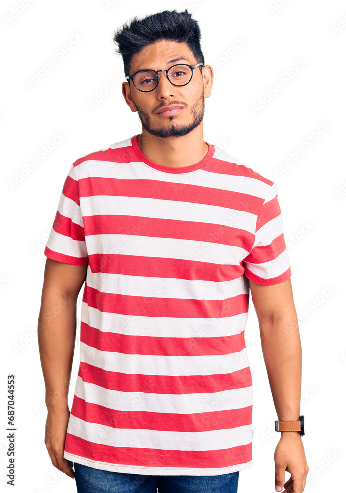 Handsome latin american young man wearing casual clothes and glasses looking sleepy and tired, exhausted for fatigue and hangover, lazy eyes in the morning. Handsome latin american young man wearing casual clothes and glasses looking sleepy and tired, exhausted for fatigue and hangover, lazy eyes in the morning.