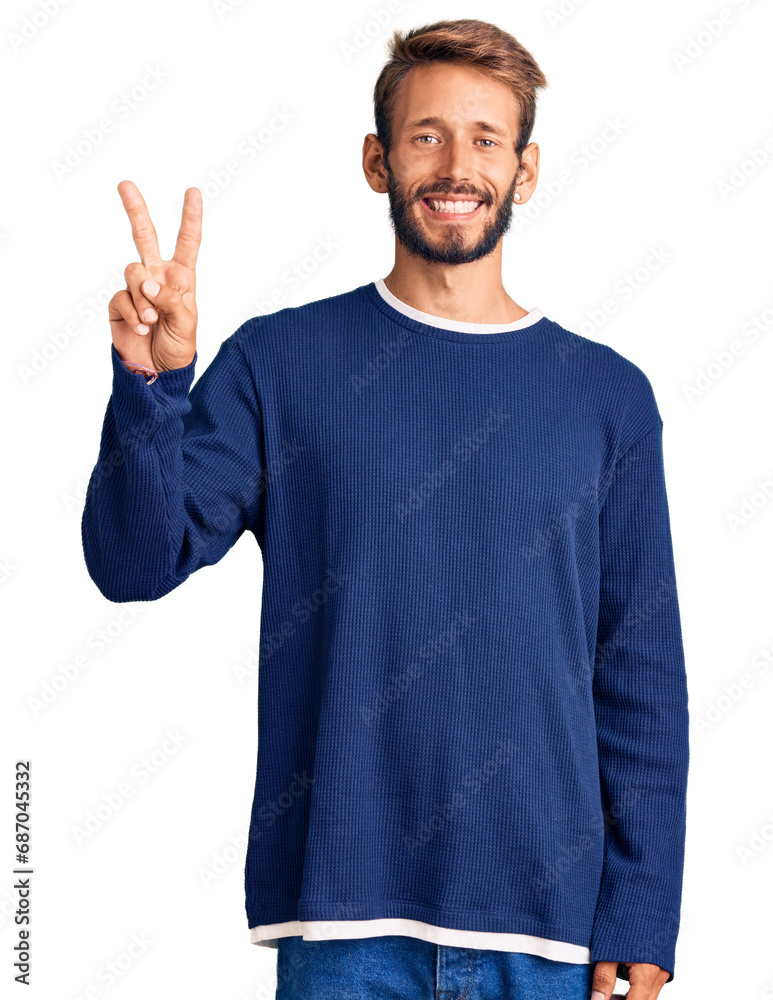 Handsome blond man with beard wearing casual sweater showing and pointing up with fingers number two while smiling confident and happy. Handsome blond man with beard wearing casual sweater showing and pointing up with fingers number two while smiling confident and happy.