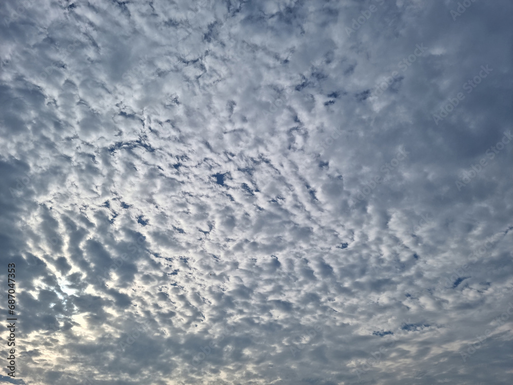 Blue sky and flake clouds.