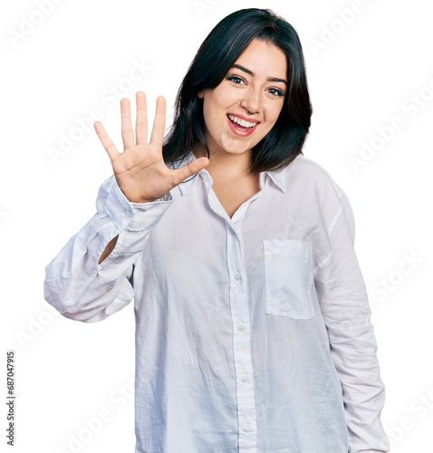 Beautiful hispanic woman wearing casual white shirt showing and pointing up with fingers number five while smiling confident and happy.