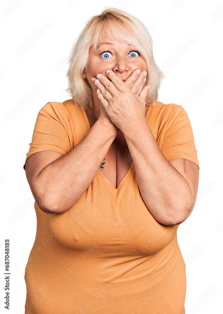 Middle age blonde woman wearing casual clothes shocked covering mouth with hands for mistake. secret concept. Middle age blonde woman wearing casual clothes shocked covering mouth with hands for mistake. secret concept.
