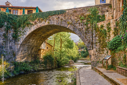 Potes bridge and Deva river in its path. In the Liebana region, Cantabria, Spain. photo