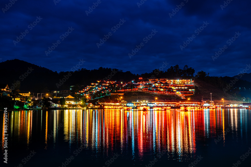 Color night light Ban Rak Thai village Beside Beautiful lake, Chinese settlement is travel destination in Mae Hong Son , Thailand
