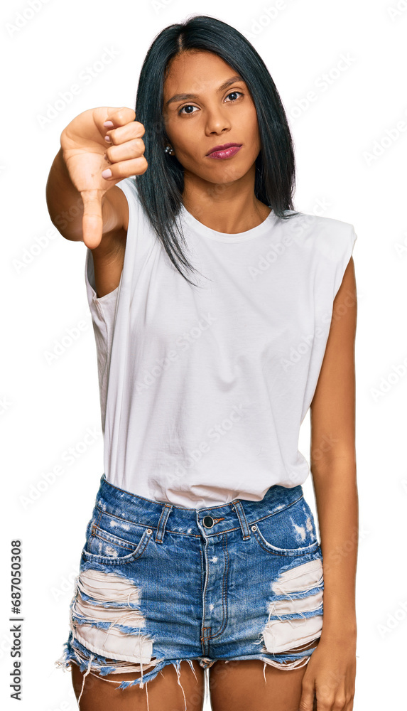 Young african american woman wearing casual clothes looking unhappy and angry showing rejection and negative with thumbs down gesture. bad expression. Young african american woman wearing casual clothes looking unhappy and angry showing rejection and negative with thumbs down gesture. bad expression.