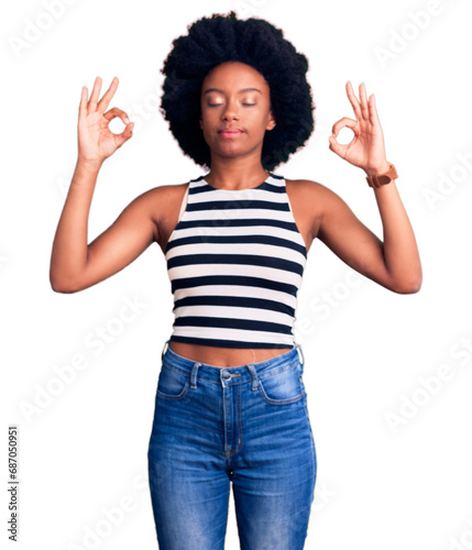 Young african american woman wearing casual clothes relax and smiling with eyes closed doing meditation gesture with fingers. yoga concept.