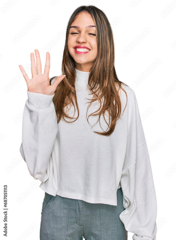 Young brunette woman wearing casual turtleneck sweater showing and pointing up with fingers number five while smiling confident and happy. Young brunette woman wearing casual turtleneck sweater showing and pointing up with fingers number five while smiling confident and happy.