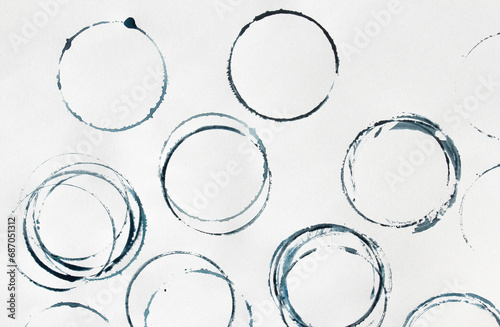 blue shapes of Wine circle and Coffee ring stains. Wine glass marks or coffee cup round stains and dirty splashes and spots isolated. Hand drawn tea or ink ring stains on white background photo