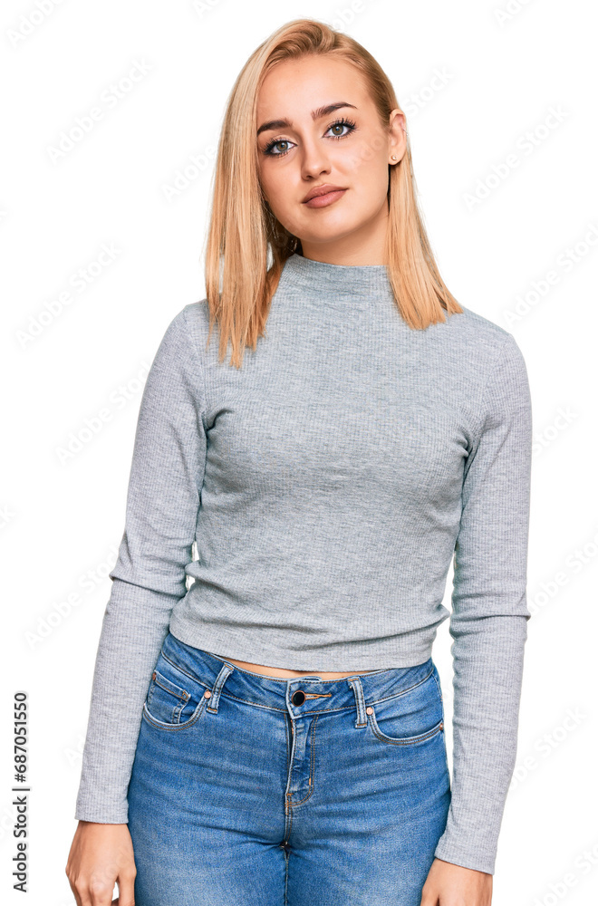 Beautiful caucasian woman wearing casual clothes relaxed with serious expression on face. simple and natural looking at the camera. Beautiful caucasian woman wearing casual clothes relaxed with serious expression on face. simple and natural looking at the camera.