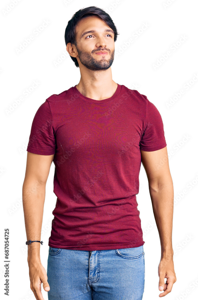 Handsome hispanic man wearing casual clothes smiling looking to the side and staring away thinking. Handsome hispanic man wearing casual clothes smiling looking to the side and staring away thinking.