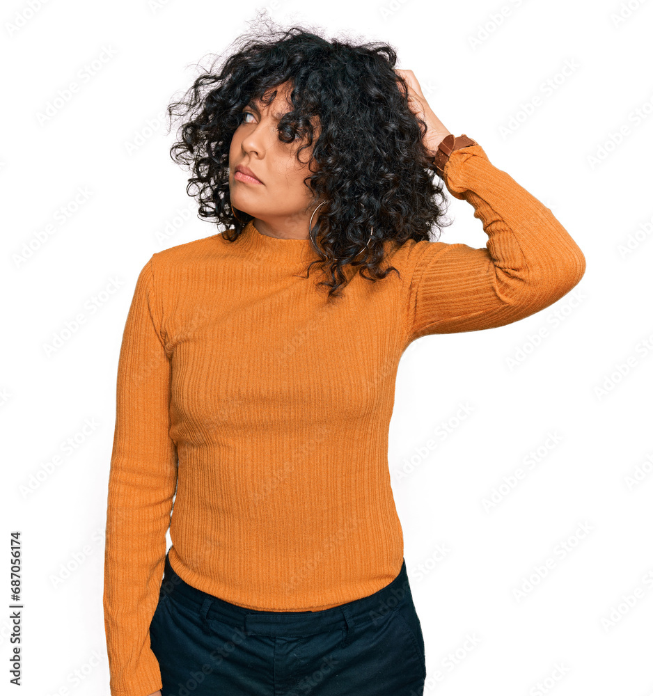 Young hispanic woman wearing casual clothes confuse and wondering about question. uncertain with doubt, thinking with hand on head. pensive concept. Young hispanic woman wearing casual clothes confuse and wondering about question. uncertain with doubt, thinking with hand on head. pensive concept.