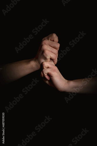 human hands with anime gestures on a black background