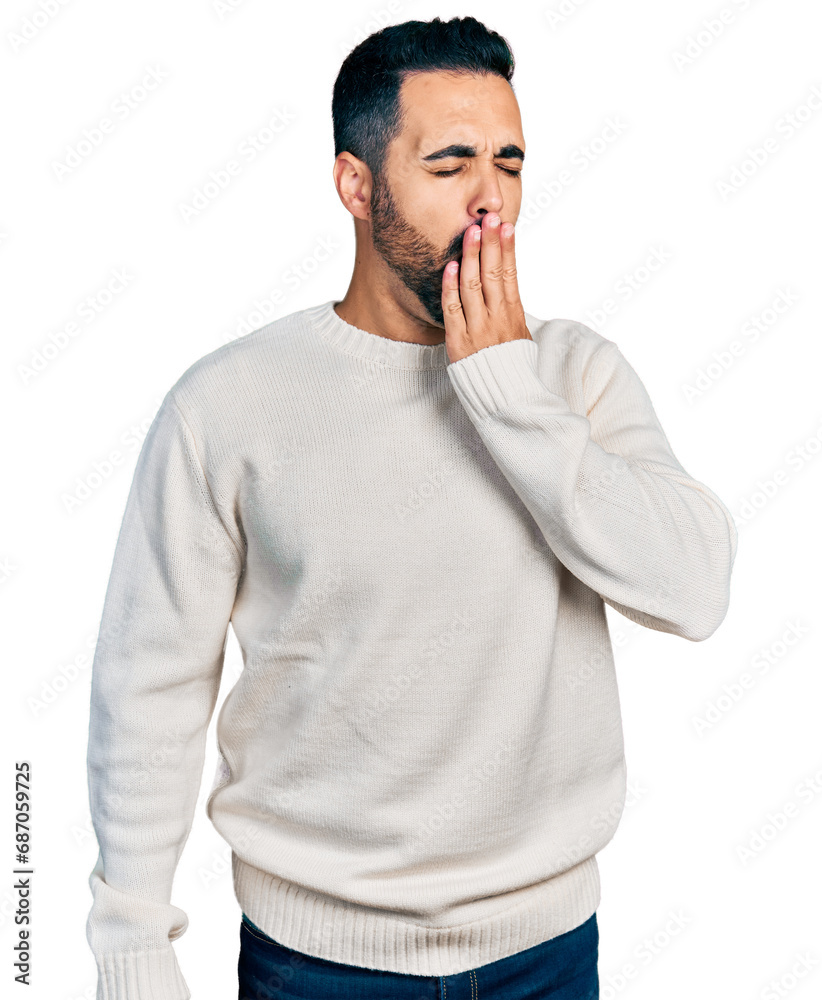 Young hispanic man with beard wearing casual white sweater bored yawning tired covering mouth with hand. restless and sleepiness. Young hispanic man with beard wearing casual white sweater bored yawning tired covering mouth with hand. restless and sleepiness.