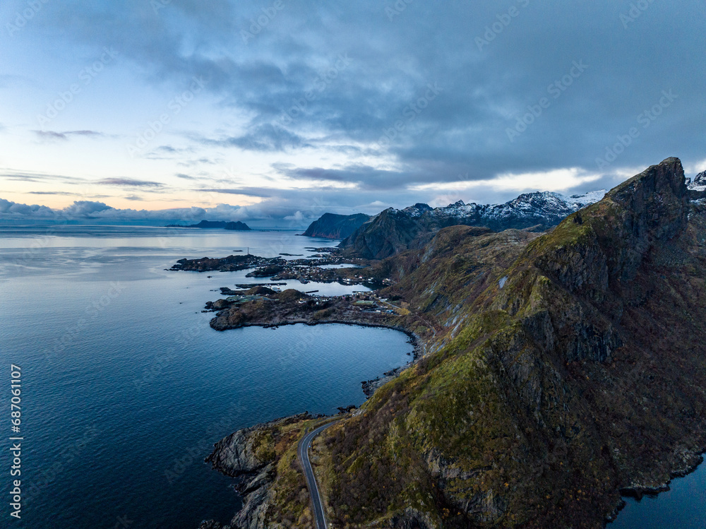 aerial view of Gylttinden mountain and road to moskenes port during morning on lofoten islands in norwat with mountains on backgorund