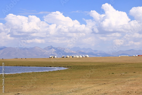 Vast Kyrgyz steppe, near Song kol lake. Mountains in far background. Kyrgyzstan