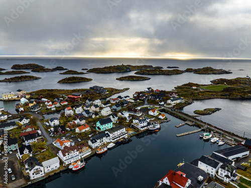 Obraz na płótnie Henningsvaer village houses on islands with boats on lofoten islands in norway, aerial view w salonie