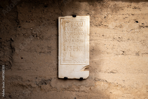 Roman tomb marble inscription of a tombstone with the information of the death Fundanus, Roman boy, son of Licinius Aecusen, who died at the age of 11 in Mérida Columbarios, Spain