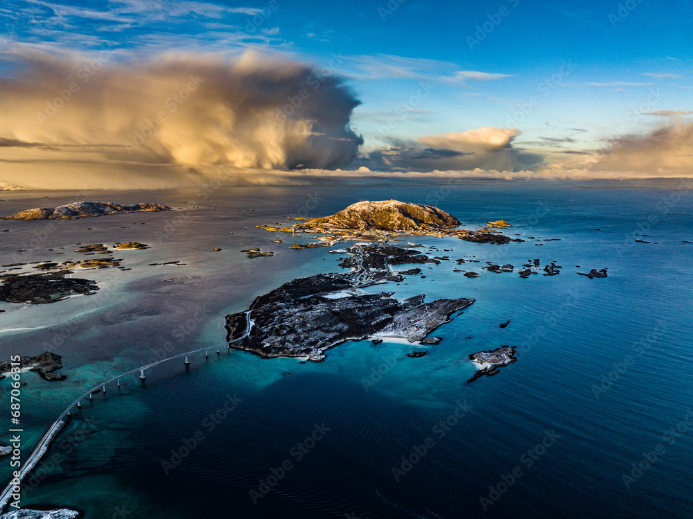 aerial view over Hillesøya and Sommarøy Islands with Storm Clouds during sunrise